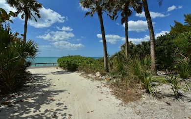 The driveway leads to 175' of private beach.