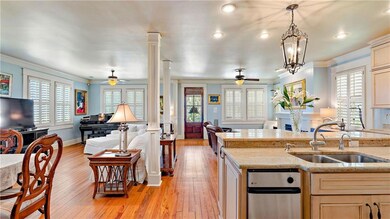 Open kitchen leads to the dining area and living a