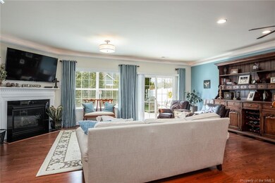 Sunny Great Room with hardwood floors and a corner