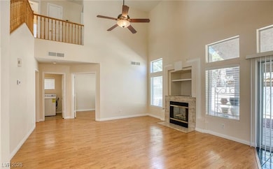Unfurnished living room featuring a fireplace, a t