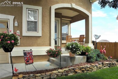 The summer view of the front steps and porch