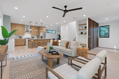 Living room featuring light wood-style floors, ce
