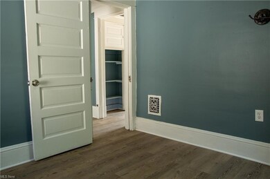 View of wood floored empty bedroom room