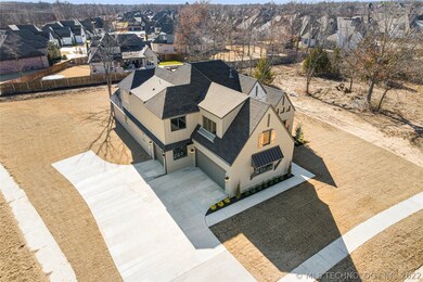 Large drive with side-entry three car garage.