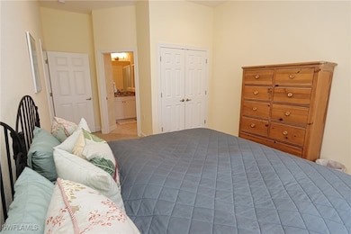 Bedroom with a closet and ensuite bath