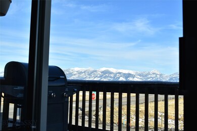 Balcony view of the Bridger Mountains from inside.