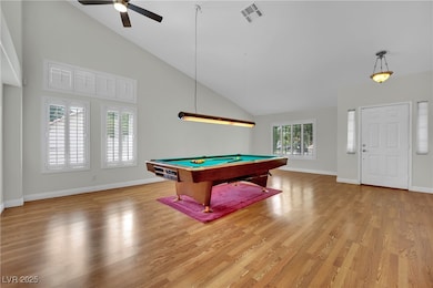 Playroom featuring ceiling fan, billiards table, l