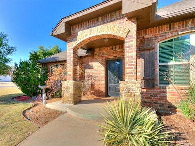 Doorway to property featuring a lawn
