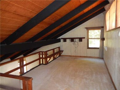 Family Room. Upper level loft area makes a great s