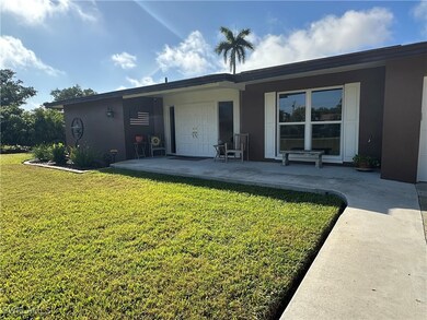 Front View of House Featuring Covered Sitting Area
