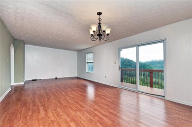 Looking towards living room, deck off of dining ro