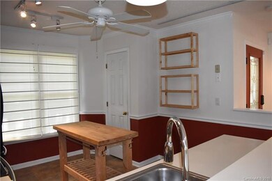 Kitchen has pantry and track lighting - just enoug