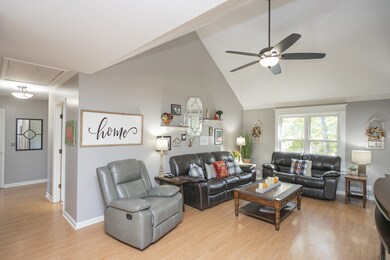 Open Living Room Area. Vaulted Ceiling. View from Main Entry. Leads to 3 Bedrooms + 2 Full Bathrooms on Main Level (Owners Suite on Main Level).