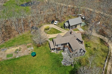 Aerial from west shows garden and overall layout.