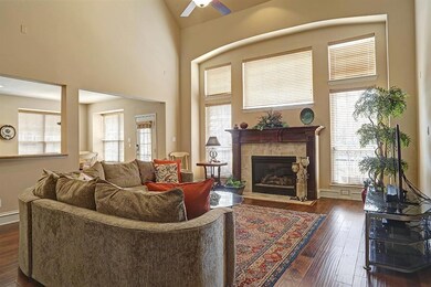 Two story main living room with gas fireplace.  Go