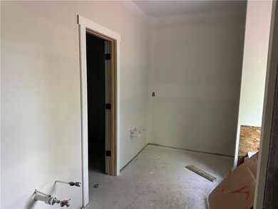 Bathroom featuring unfinished concrete floors