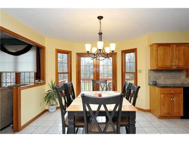 Kitchen. A bump out is lined with 2 windows and a 