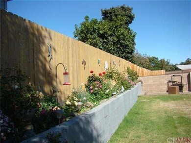 Newer fence with nice area for flower beds, or sma