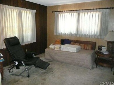 MAIN FLOOR BEDROOM CURRENTLY USED AS A DEN.