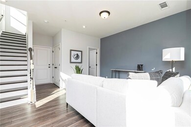 Luxury Vinyl Planks in the common areas with oak treads