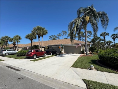 Single story home with a garage, a front lawn, and