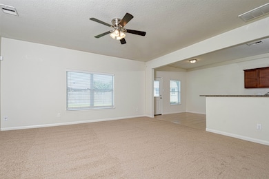 Spacious living room open to the breakfast area.