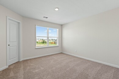 Spare room with light colored carpet and baseboards