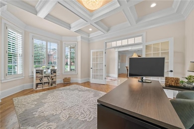 Home office with coffered ceiling, french doors, c