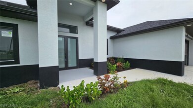 View of side of property with french doors