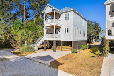 View of front of property featuring a balcony, a f