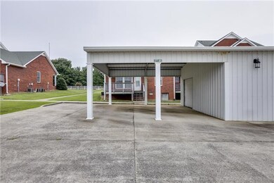 2 car covered carport with additional storage unit