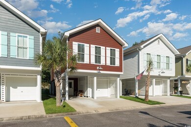 Townhome / multi-family property featuring a garag