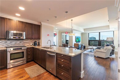 Kitchen featuring kitchen peninsula, stainless ste