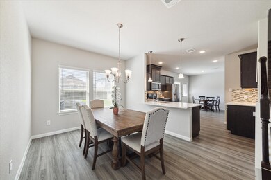 Dining room opens to kitchen and breakfast area.