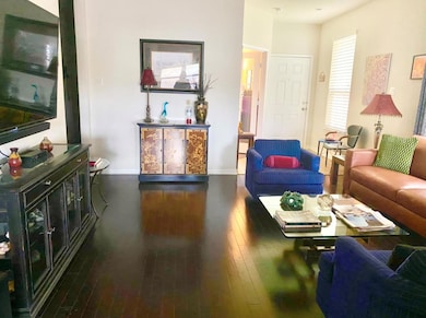 Living area featuring wood-type flooring and base