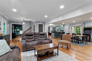 Living room with light hardwood / wood-style floor