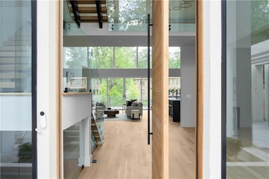 Entryway with wood finished floors and a towering 