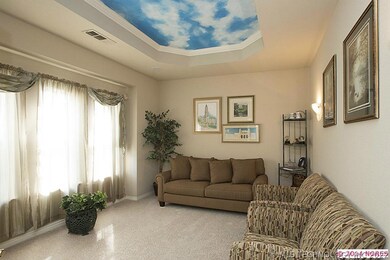 The living room/office just off the entry hall has French doors which allow for multiple uses.