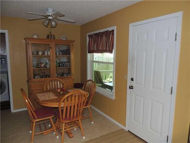Kitchen. Eat-in kitchen area.  Door goes out to co