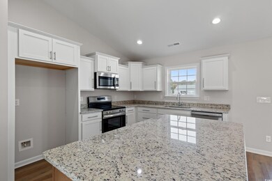 Kitchen featuring a sink, appliances with stainles