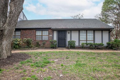 View of front of home with brick siding and roof w