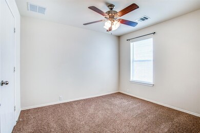 Unfurnished room featuring visible vents, ceiling