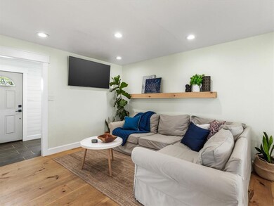Such a great living space! Beautiful pine floors, too!