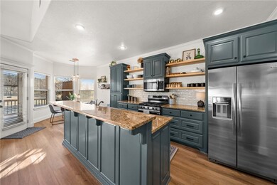 The kitchen seamlessly integrates with the open fl