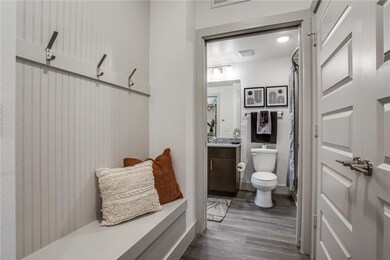 Bathroom with vanity, hardwood / wood-style flooring, and toilet