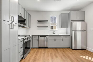 Kitchen featuring light countertops, stainless ste