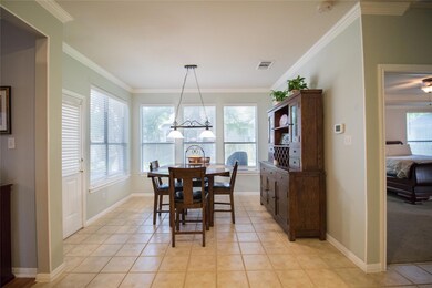 Dining space featuring crown molding, a wealth of