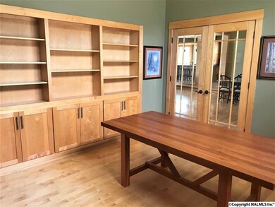 JUST OFF THE FOYER YOU WILL FIND THE PRIVATE OFFICE WITH BUILT IN SHELVES.  UNBELIEVABLE !!!