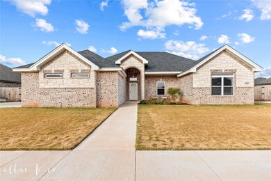 6810 Red Yucca Rd front of house with manicured la