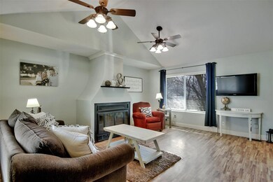 Living room has wood burning fireplace.